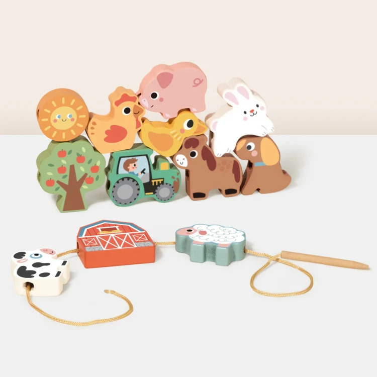 Zbliżenie na kolorowe ilustracje drewnianych figurek z nawlekanki Farma Woopie Green