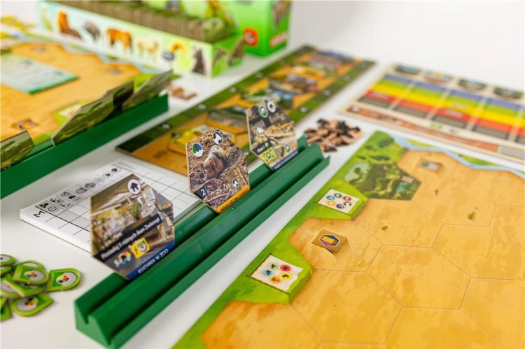 Kafelki zwierząt, budynków i projektów w grze planszowej Rezerwat Portal Games