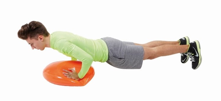 Detal wypustek na powierzchni dysku Gymnic Disco Sport, pokazujący fakturę i rozmieszczenie elementów stymulujących