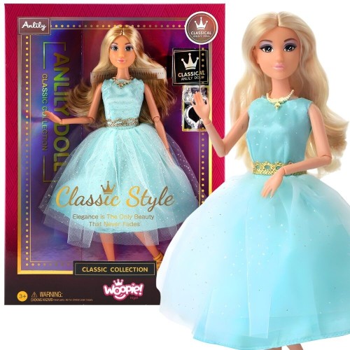 Lalka Woopie Royal Lily 30 cm w turkusowej sukience z tiulową spódnicą i złotymi akcesoriami na tle jasnym
