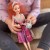 Akcesoria do Lalka Emi Style Fashion 32 cm WOOPIE ROYAL ułożone obok lalki — dodatki garderoby i elementy stylu