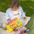 Widok boczny autobusu z otwartą kabiną i schowkiem na elementy — moduły Montessori do eksploracji WOOPIE BABY