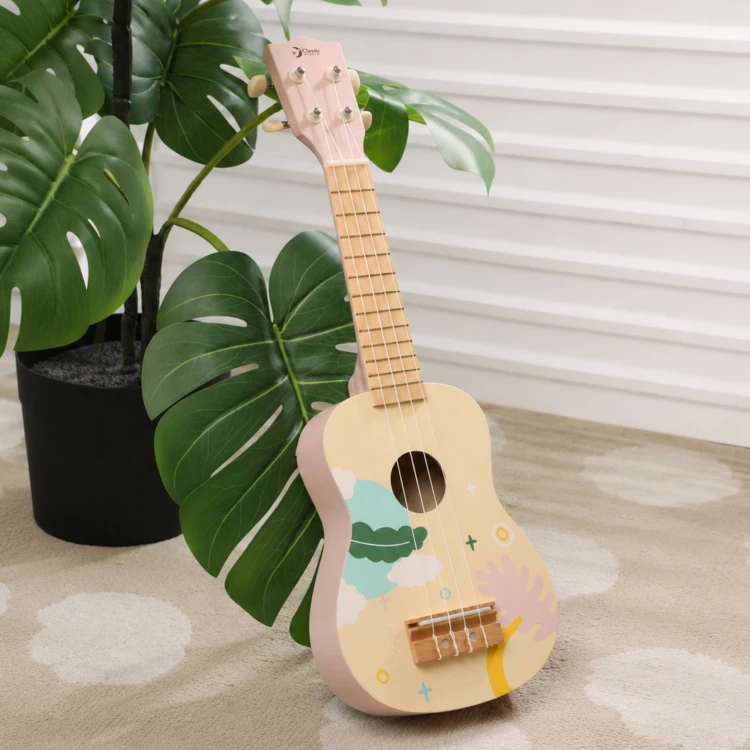 Widok z boku drewnianego ukulele dla dzieci CLASSIC WORLD — profil pudła i szyjki instrumentu w różowym odcieniu