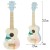 Ukulele CLASSIC WORLD na jasnym tle — podkreślone kształty korpusu i intensywność niebieskiego lakieru