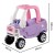Maluch bawi się jeździkiem Cozy Coupe Truck LITTLE TIKES — scena użytkowania na podwórku, naturalna zabawa i ruch.