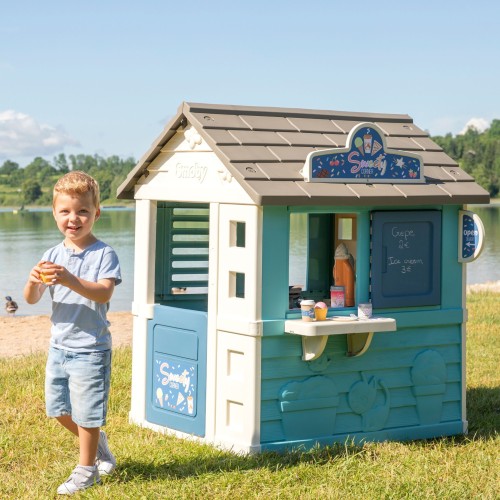 Wnętrze domku Lodziarnia Sweety Corner SMOBY — widoczna lada sprzedażowa i przestrzeń do zabawy od środka