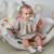 Detal powierzchni grzechotki WOOPIE BABY — kontrastowe wzory, tekstury i elementy do stymulacji wzroku oraz dotyku