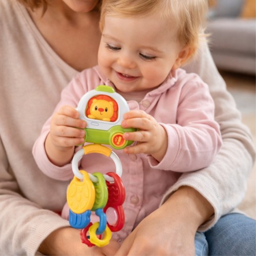 Zbliżenie na kolorowe przyciski interaktywnego pilota Woopie Baby — detal klawiszy i kluczyków