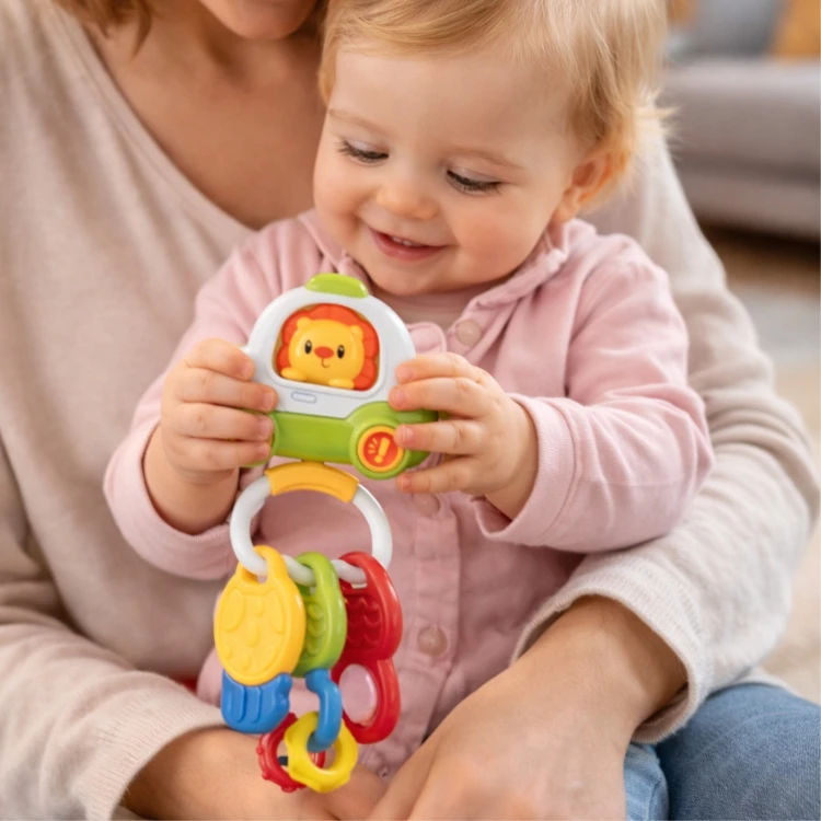 Zbliżenie na kolorowe przyciski interaktywnego pilota Woopie Baby — detal klawiszy i kluczyków
