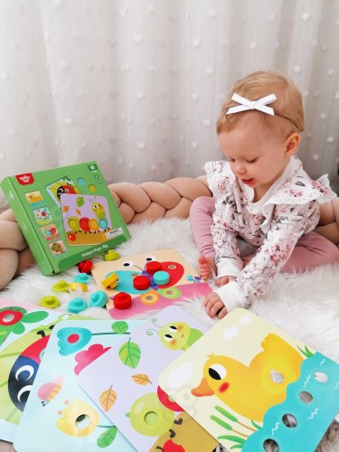 Figurka zwierzęcia z układanki TOOKY TOY — detal kształtu i żywe kolory na planszy