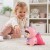 Boczny profil zabawki WOOPIE BABY — widoczne świecące elementy, kolorowe przyciski i ergonomiczną rączkę