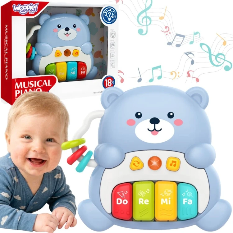 Interaktywne pianinko Miś Woopie Baby w jasnoniebieskim kolorze dla dzieci od 18 miesięcy