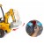 Tył koparki FEBER Super Digger — widoczna pokrywa baterii LT 12V oraz tylne koła i osłony