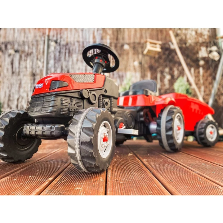 Widok z tyłu na przyczepę traktora WOOPIE Farmer GoTrac MAXI — otwarta burta i mechanizm zawiasów