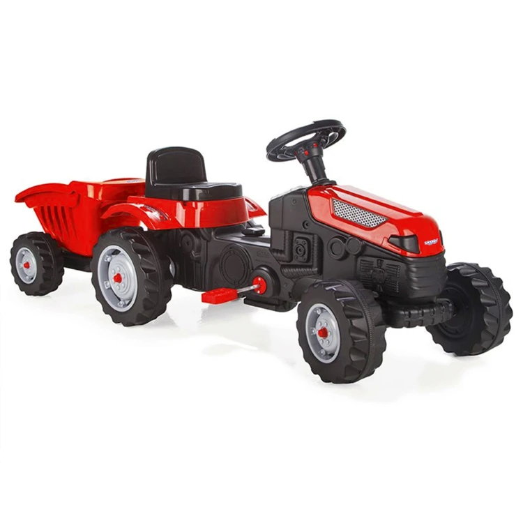 Traktor WOOPIE ustawiony na trawie — ujęcie eksponujące Ciche Koła oraz stabilność i formę przyczepy