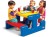 Stolik piknikowy Little tikes ustawiony w ogrodzie — dzieci korzystają z niebieskiego blatu podczas zabawy