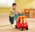 Jeździk Cozy Coupe Little Tikes — bok: pojemny schowek pod siedzeniem i solidne, skrętne kółka