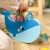 Zbliżenie na drewnianą figurę wieloryba z otworami do nawlekania — detal TOOKY TOY