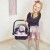 Nosidełko WOOPIE ROYAL na lalce 33–48 cm — model pokazany w użyciu, ergonomiczne ułożenie pasów