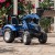 Przyczepa do traktora na pedały FALK New Holland T8 — ujęcie z tyłu pokazujące zaczep i skrzynię