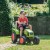 Traktor na pedały Falk — ujęcie boczne z podłączoną przyczepą, widać zawias i proporcje pojazdu
