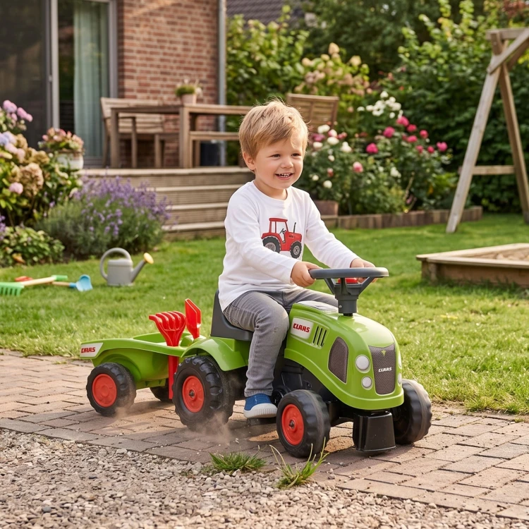 Zbliżenie na kierownicę i siedzenie traktorka FALK Baby Claas — detal ergonomii, tekstura kierownicy i wykończeń