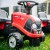 Detal mocowania przyczepki do jeździka Baby Case IH — zaczep i mechanizm w zbliżeniu, marka FALK