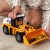 Detal kół i ogumienia koparko-ładowarki WOOPIE — widoczne bieżniki i osie