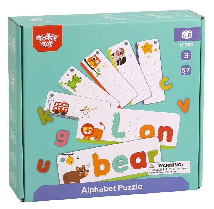 Cały zestaw puzzli Alfabet TOOKY TOY rozrzucony na stole — 57 elementów w różnych kolorach