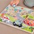 Plansza z wycięciami do dopasowywania kształtów — puzzle pojazdy i miasto z motywami TOOKY TOY