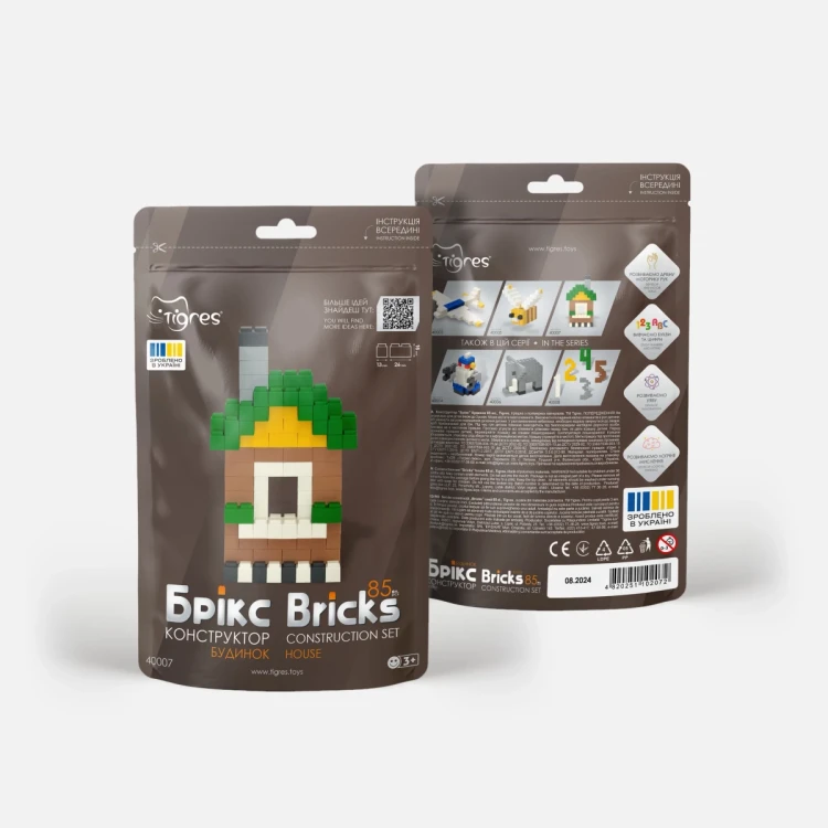 Klocki Bricks rozrzucone na jasnym tle, prezentacja wszystkich pięciu kolorów i różnorodności elementów w komplecie 85 sztuk