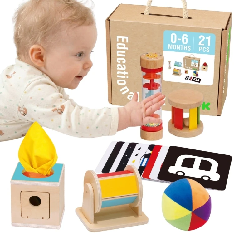 TOOKY TOY Box Pudełko XXL Montessori 6w1 — widok z góry na kolorowe elementy sensoryczne.