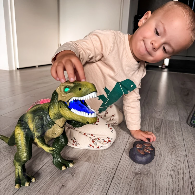 Boczny widok WOOPIE T-Rex — widoczne ruchome nogi i ogon podczas pokazu mobilności robota