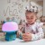 Opakowanie i etykiety WOOPIE — turkusowa lampka RGB z informacjami o funkcjach Bluetooth, karaoke i wejściach audio