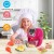 Instrukcja i naklejki obok WOOPIE Air Fryer — materiały informacyjne i dekoracyjne do zabawy z urządzeniem