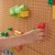Komplet nakładek ułożony obok panelu — pokazany sposób rozstawienia czterech elementów MASTERKIDZ