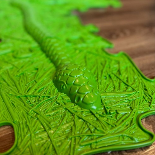 Zbliżenie na fakturę piankowych puzzli WOOPIE — elementy w kształcie węża i łączenia