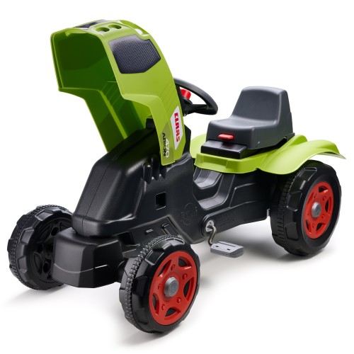 Traktor Claas Arion 470 FALK z odczepianą przyczepką na tle zielonej trawy