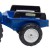Traktor New Holland T8 FALK na pedały na tle ogrodu