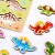 Zestaw TOOKY TOY z drewnianymi puzzlami dla dzieci z motywem dinozaurów i wulkanu