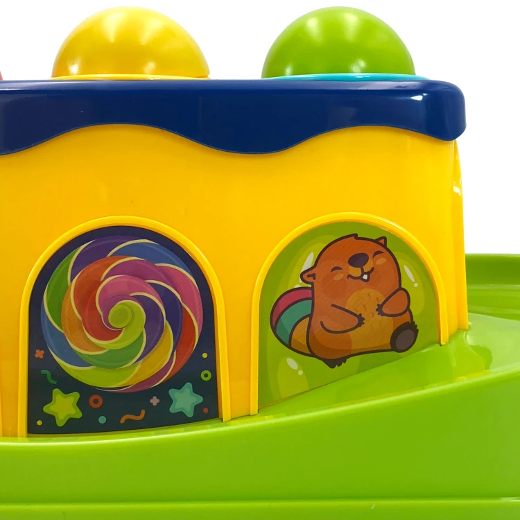 Zestaw do przebijania Woopie Baby z widocznymi trzema kulkami i młoteczkiem